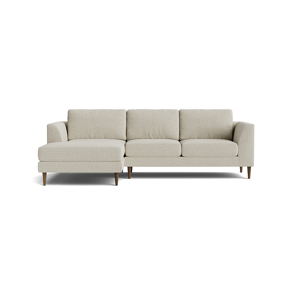Introducing the Dekayess Chaise 98" Sectional: a contemporary beige sectional sofa featuring three seat cushions and a left-side chaise. Crafted from textured fabric, it elegantly rests on wooden legs, all set against a clean white backdrop.