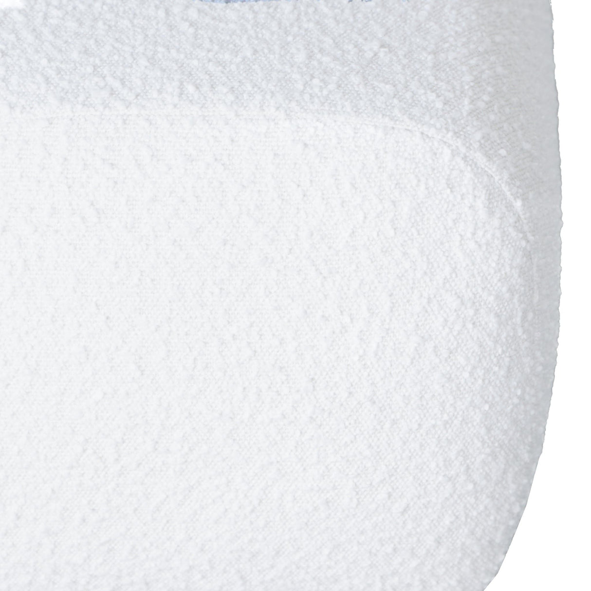 Close-up of the white textured surface of the Kelvin - Minimalist Design Bench featuring a curved edge, resembling soft plush fabric.