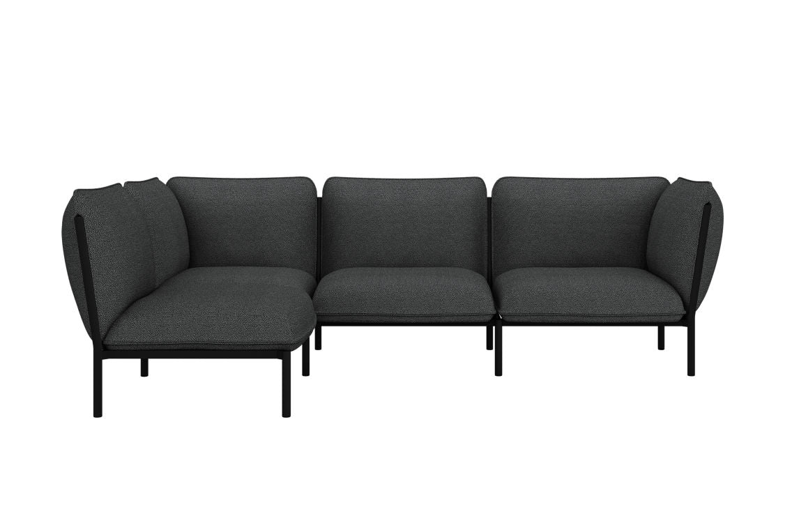 The Kumo Corner Sofa Left with Armrest features a modern design with dark gray upholstery and sleek black legs. Its L-shaped modular configuration showcases simple, clean lines, making it an ideal fit for a contemporary interior setting.