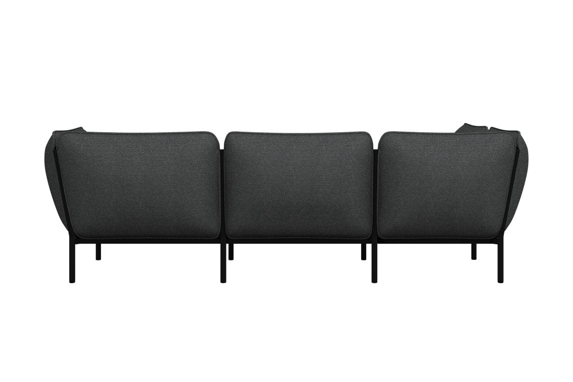 This Kumo Corner Sofa Left with Armrest showcases a stylish and modern design in dark gray, offering three seats and featuring sleek black legs for a minimalist look, viewed from the back.