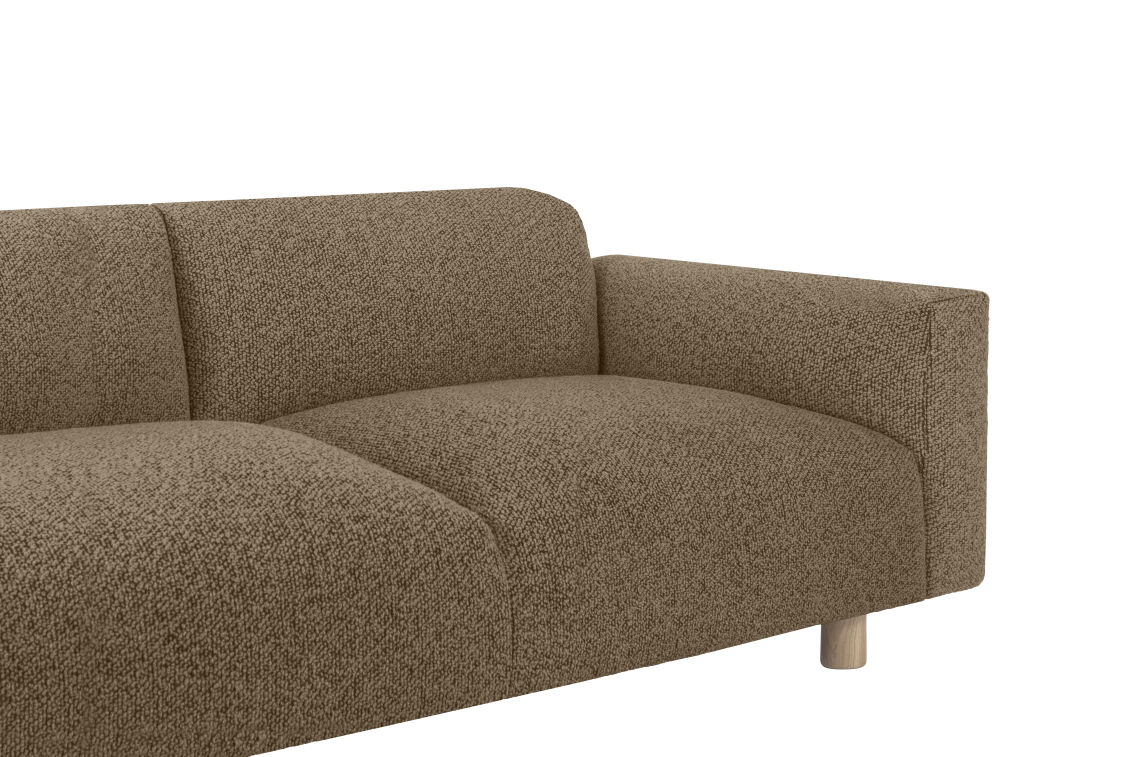 Here's a rewritten version of the sentence using the provided product data:
A close-up view of the Koti 2-seater Sofa, showcasing its modern design with brown fabric and a textured surface. This sofa features a low backrest and an armrest on the right side, supported by cylindrical wooden legs. The background is plain white.