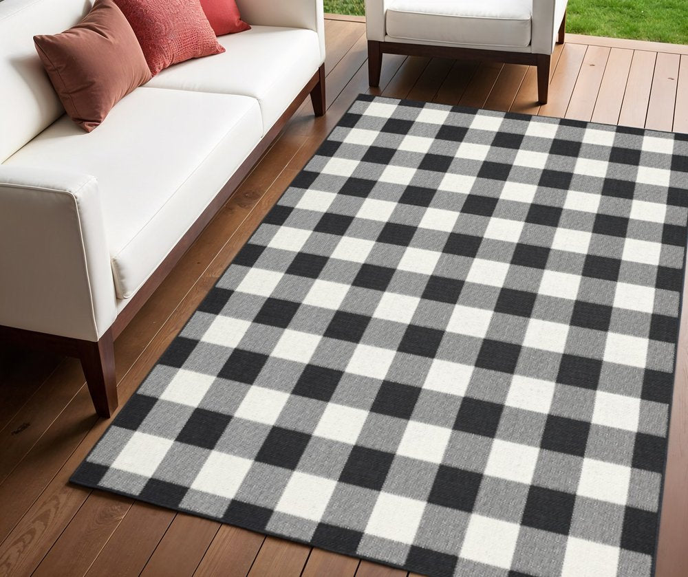 2' X 4' Black and Ivory Indoor Outdoor Area Rug