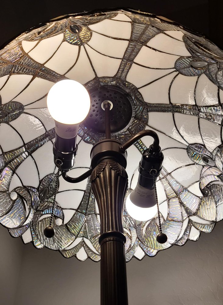 62" Dark Brown Two Light Torchiere Floor Lamp With White Fleur de Lis Glass Dome Shade