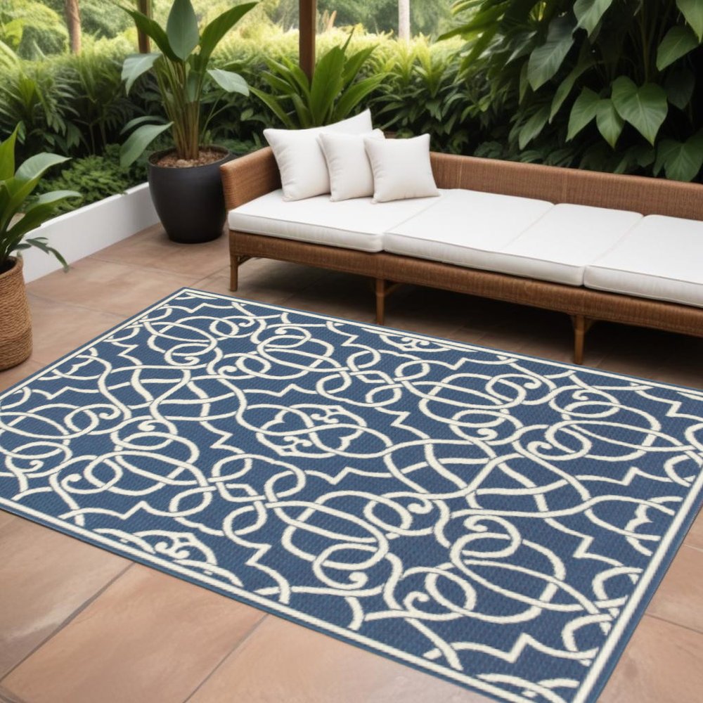 9' X 13' Blue and Ivory Geometric Stain Resistant Indoor Outdoor Area Rug
