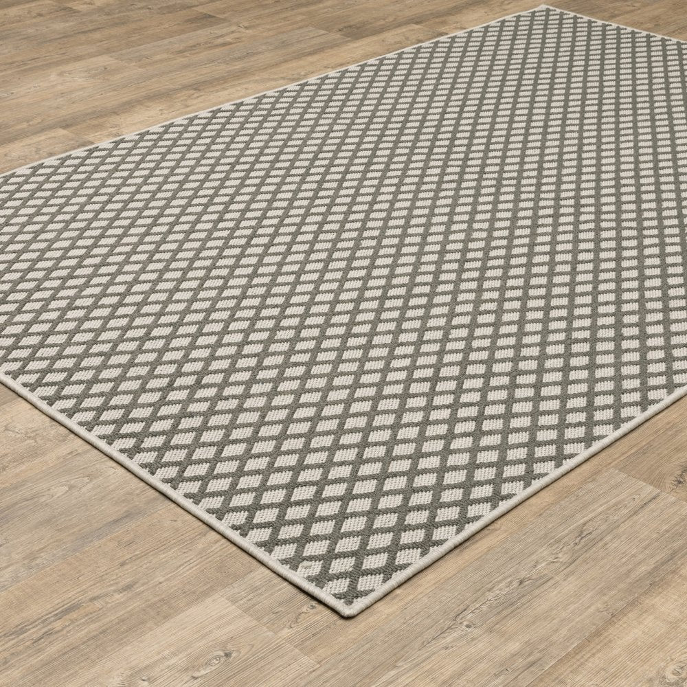 7' X 9' Beige Geometric Stain Resistant Indoor Outdoor Area Rug