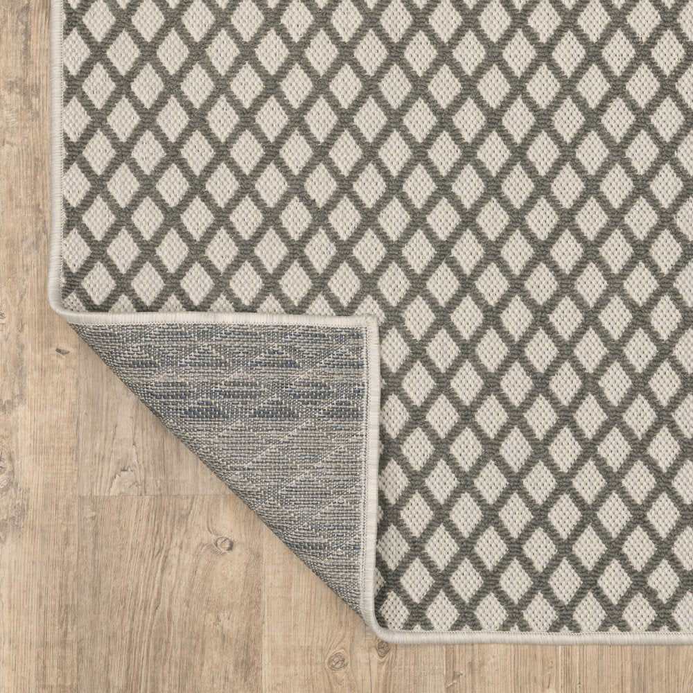 7' X 9' Beige Geometric Stain Resistant Indoor Outdoor Area Rug