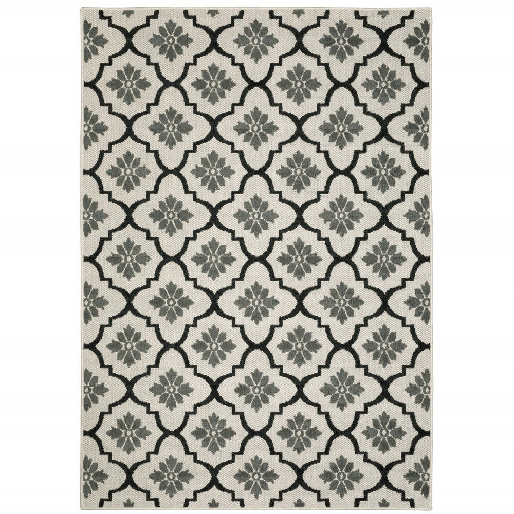 7' X 9' Beige and Black Geometric Stain Resistant Indoor Outdoor Area Rug