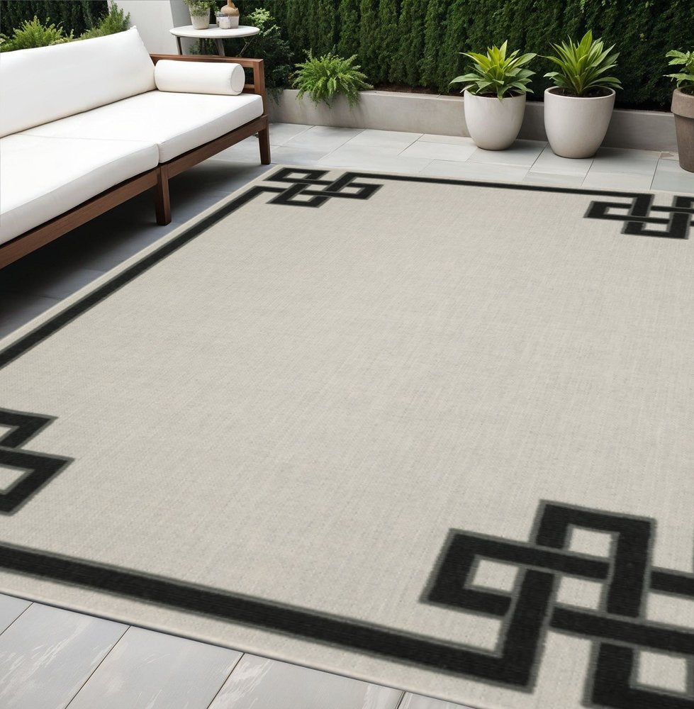 5' X 7' Beige and Black Stain Resistant Indoor Outdoor Area Rug