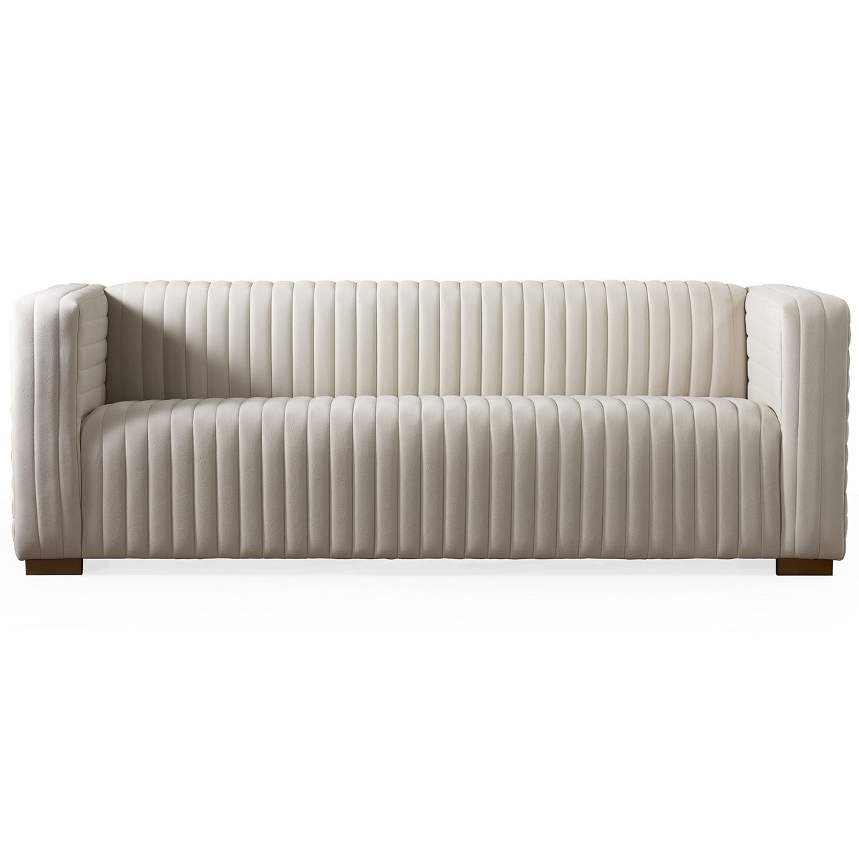 The Elara Upholstered Sofa features a modern white design with vertical tufted lines, wooden legs, straight arms, and backrest. Its low-profile build offers a sleek look perfect for a contemporary living room.