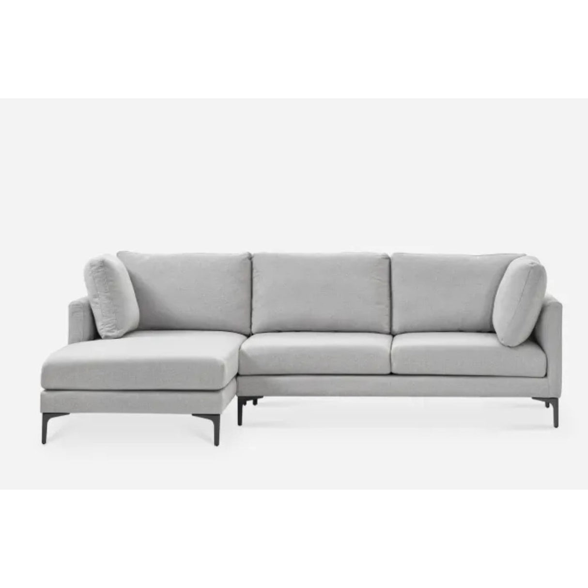 A modern light gray sectional sofa with an L-shaped design, featuring plush cushions and a chaise on the left side. The sofa has sleek black legs and is set against a plain white background.