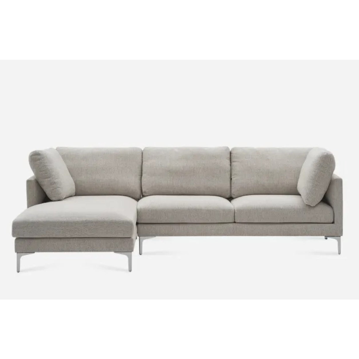 A modern L-shaped gray sofa with cushioned seats and backrests on a white background. It has sleek, metallic legs and two additional pillows on either end.