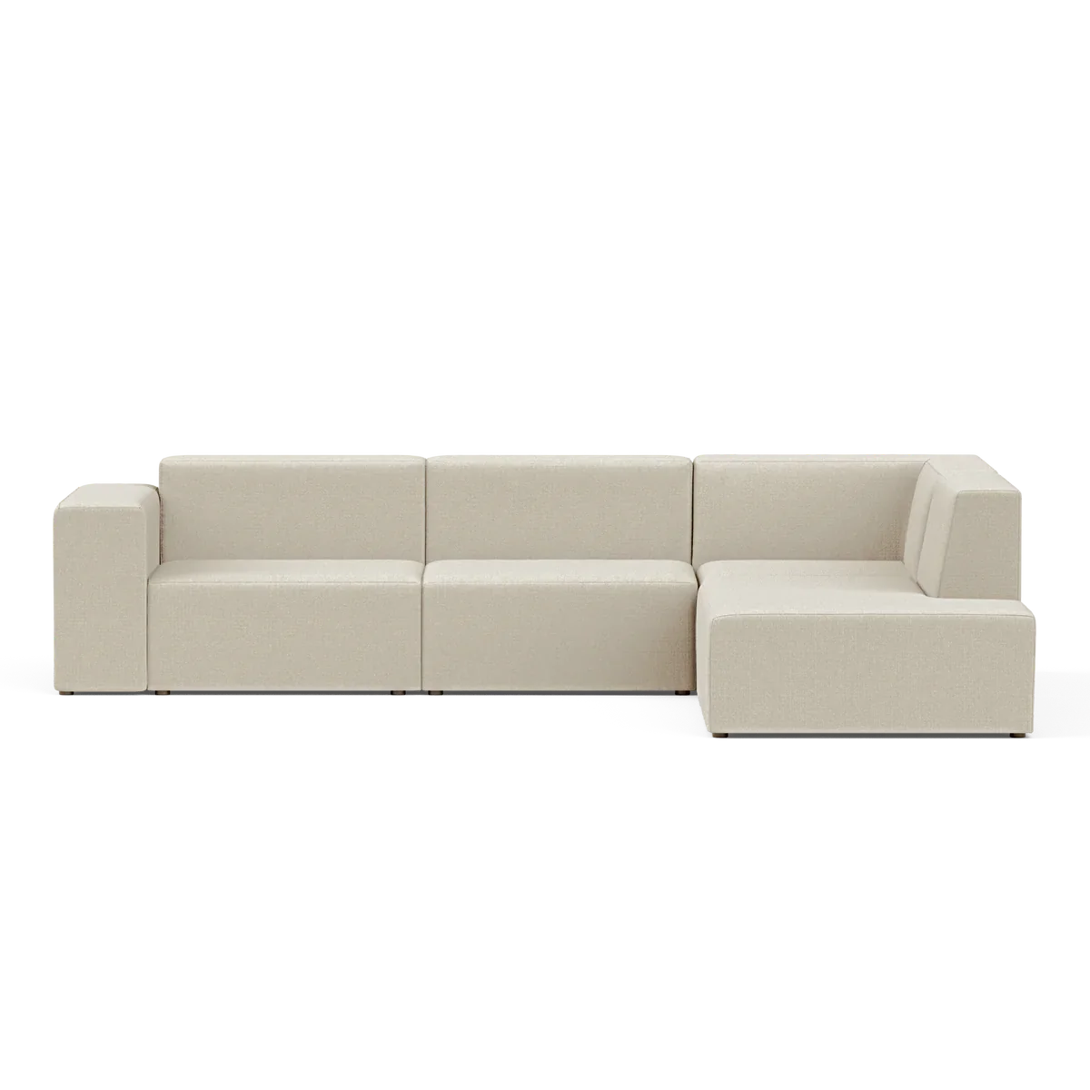 The Four-Seater Form Sectional is a spacious, contemporary beige sofa with a sleek, minimalist design. It boasts clean lines and an inviting appearance with a right-facing chaise lounge, set against a simple black backdrop.