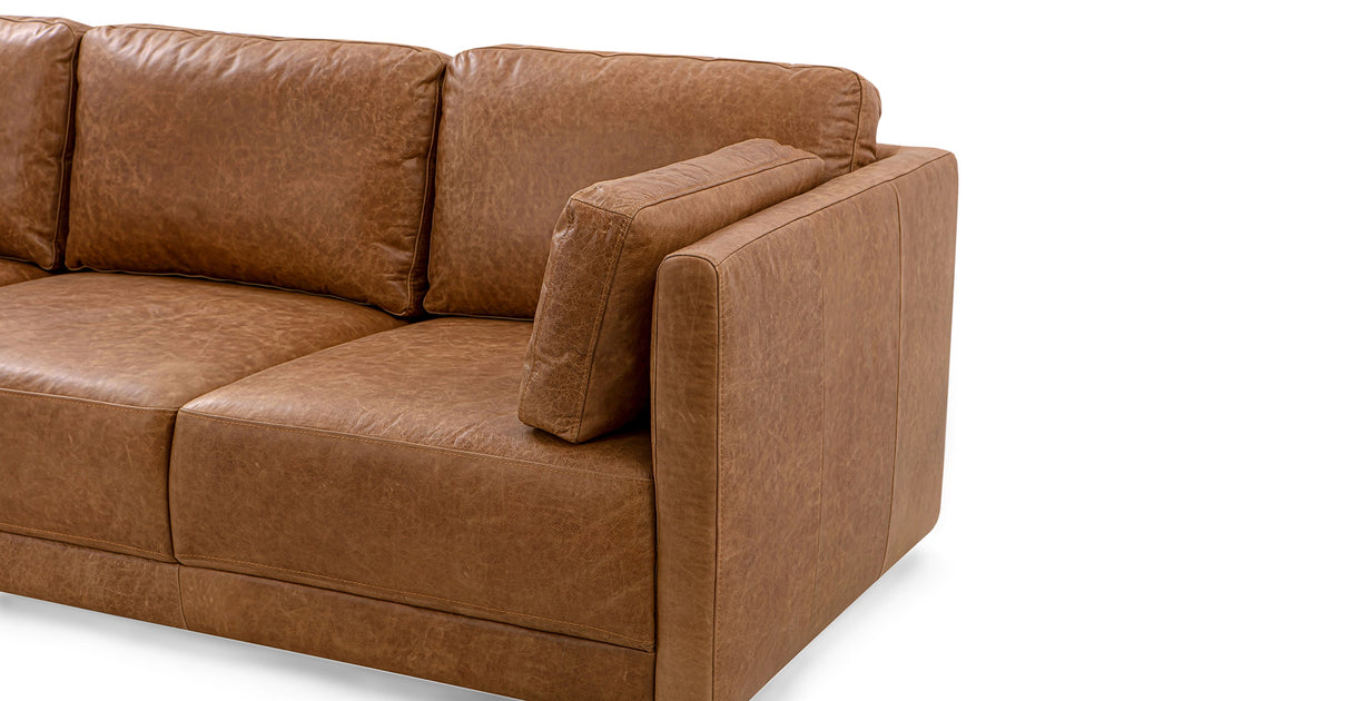 Domus 93" Leather Sofa in Chestnut, featuring a wide armrest and extra cushion, showcases a modern design against a white backdrop with its image highlighting the right-hand side.