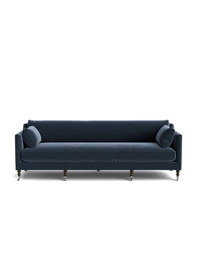 Introducing the Fabienne Sofa: a contemporary piece in dark blue, featuring clean lines and two cylindrical pillows at each end. The sofa is elevated on slender, tapered legs that contrast elegantly with the dark upholstery. Its sleek design is accentuated by a solid black background.