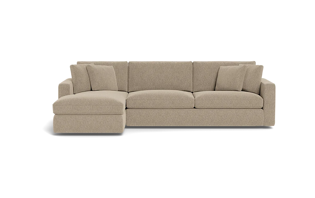 Introducing the James 3 Seat Left Chaise 92" Sectional, a beige sectional sofa featuring three large seat cushions and a left chaise lounge. The backrest is adorned with five plush cushions, complemented by wide armrests on each end. The sofa is elegantly displayed against a plain black background.
