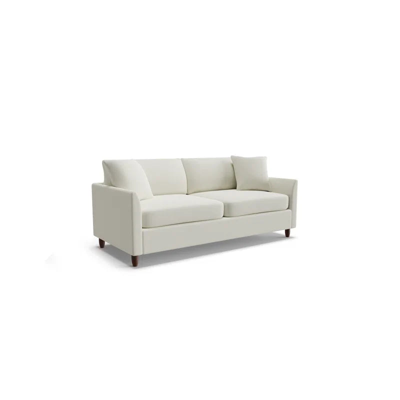 The Kodie 76.5" Upholstered Sleeper Sofa is a modern three-seater featuring a light gray fabric with clean lines and square cushions, set against a white background. It is supported by dark wooden legs.
