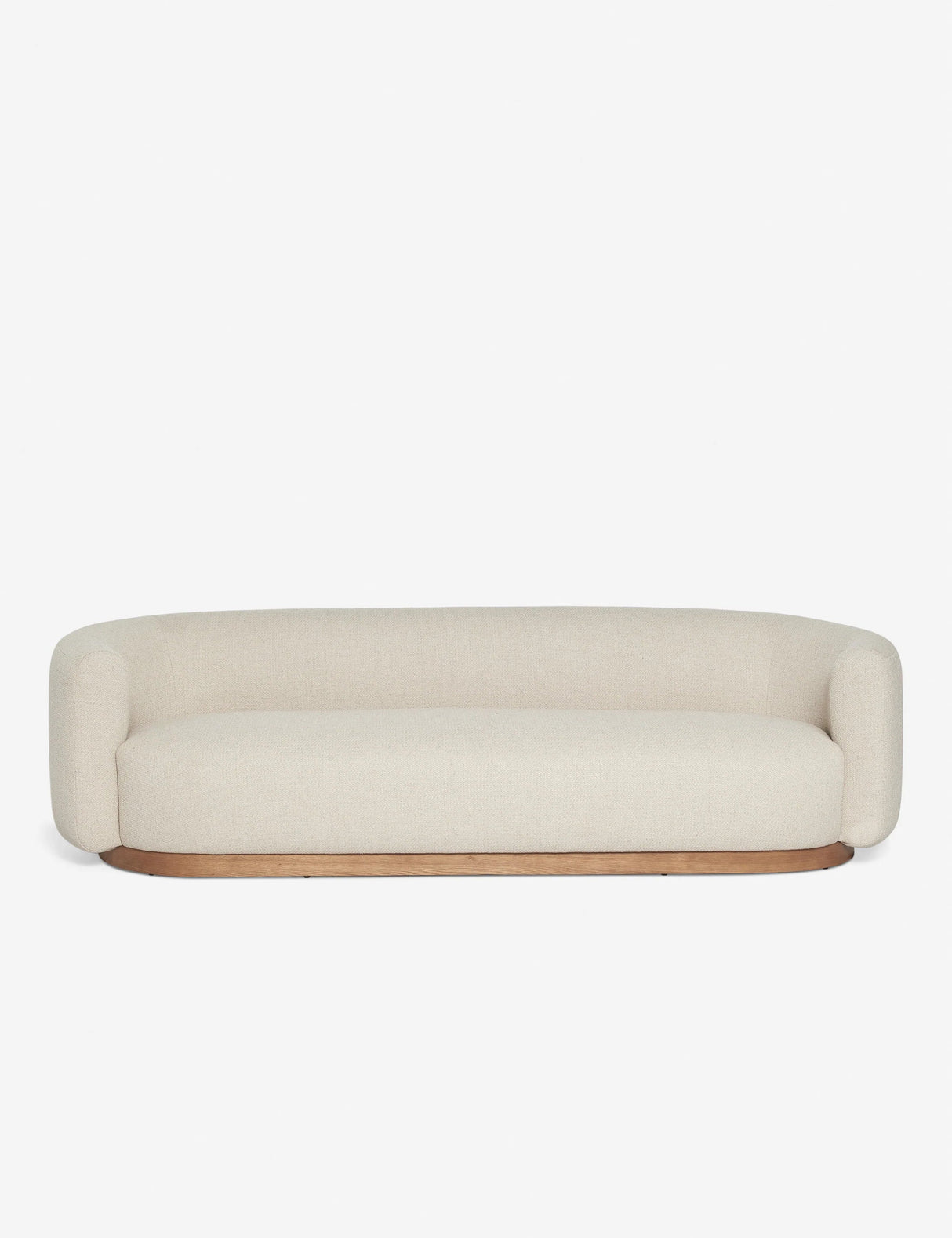 The Lowry Sofa is a modern and minimalist beige piece, featuring rounded edges and a sleek wooden base, set against a plain white background.