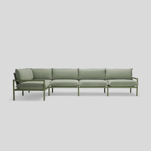 The Terra Sectional is a minimalist green sofa featuring five seat cushions and matching back cushions on a sleek metal frame, set against a plain white background.