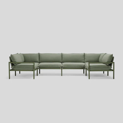Terra Sectional, an L-shaped outdoor sofa with cushioned seats and an aluminum frame in green, set against a plain light gray background.