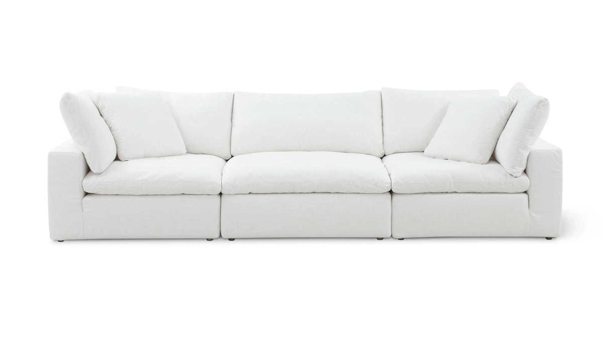 The Movie Night 3-Piece Modular Sofa is a modern white sofa with plush cushions, featuring three sections. Its clean lines and minimalist design offer a cozy yet stylish look, perfect for contemporary living spaces.