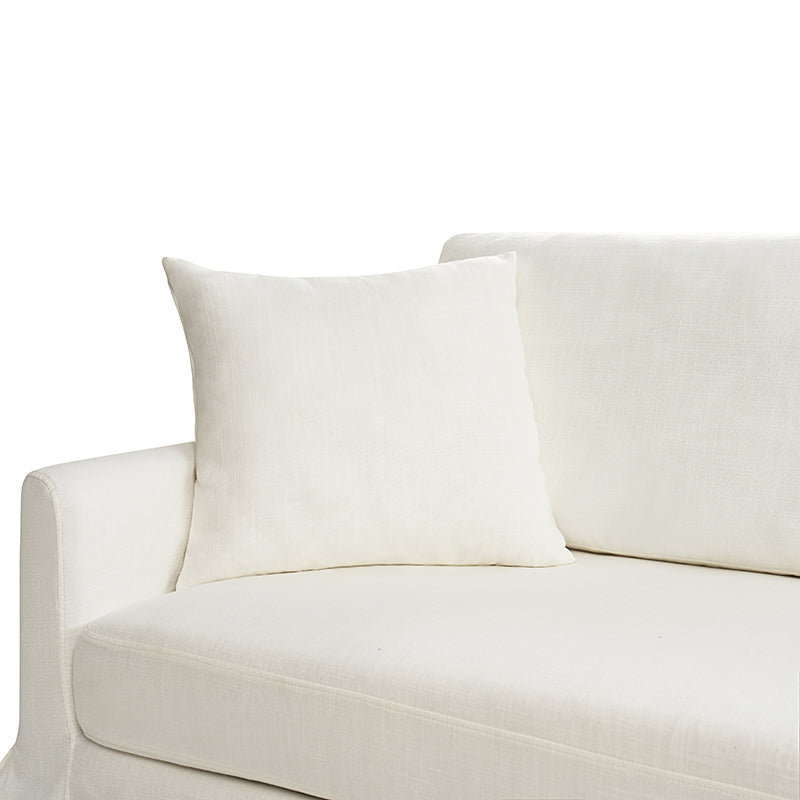 A white Torsten Modern Comfortable Sofa featuring a minimalist design, complete with a matching square pillow on the left side. The fabric looks soft and pristine, contributing to a simple, elegant appearance. The image highlights the left armrest and part of the seat cushion.