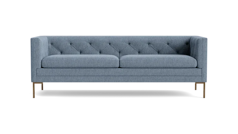 The Sit Tight 90" Sofa features a contemporary gray design with a tufted backrest and slim metal legs, set against a black background. It includes two large seat cushions and boasts a sleek, minimalist style.