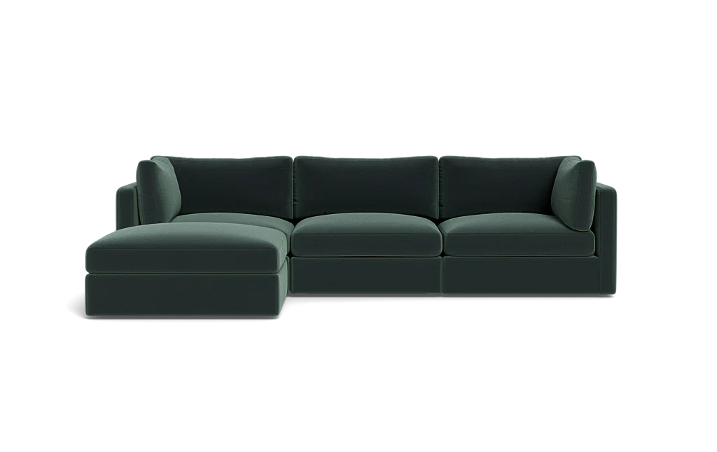 The Tatum Modular 3 Seat Chaise Sectional, featuring sleek cushions and a left-sided chaise in dark green, is set against a plain black background.