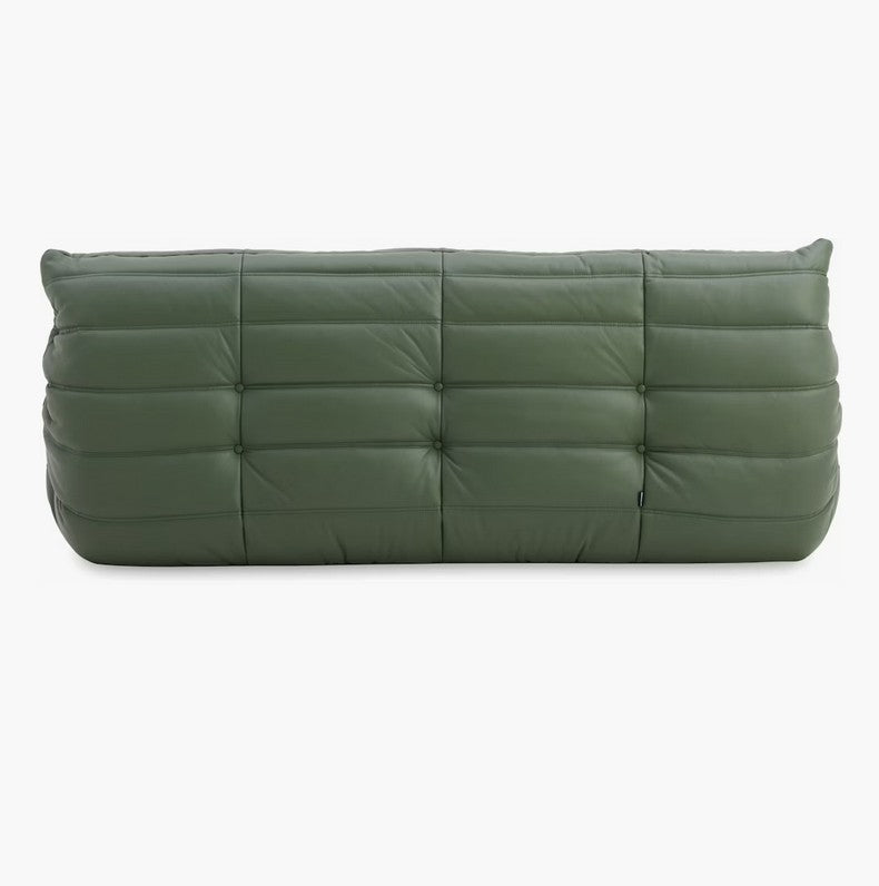 The Togo Sofa in Opera Leather is a spacious, plush, rectangular green seating option featuring button tufting detail. It is designed for seating or lounging, with horizontal and vertical stitching that gives it a quilted appearance.