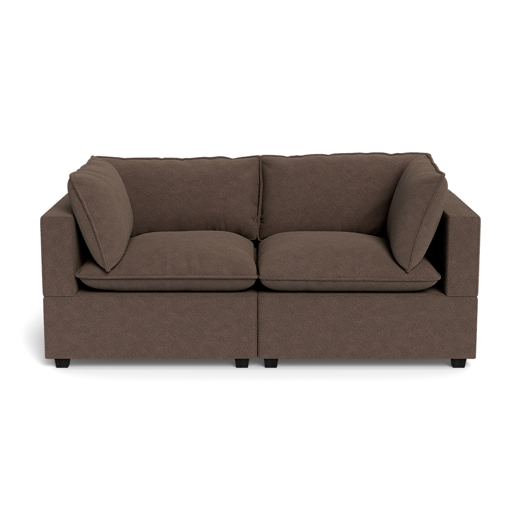 The Kova Pillow Cushion Sofa 86" is a modern brown two-seater with square arms and plush seat and back cushions, shown against a plain black background.