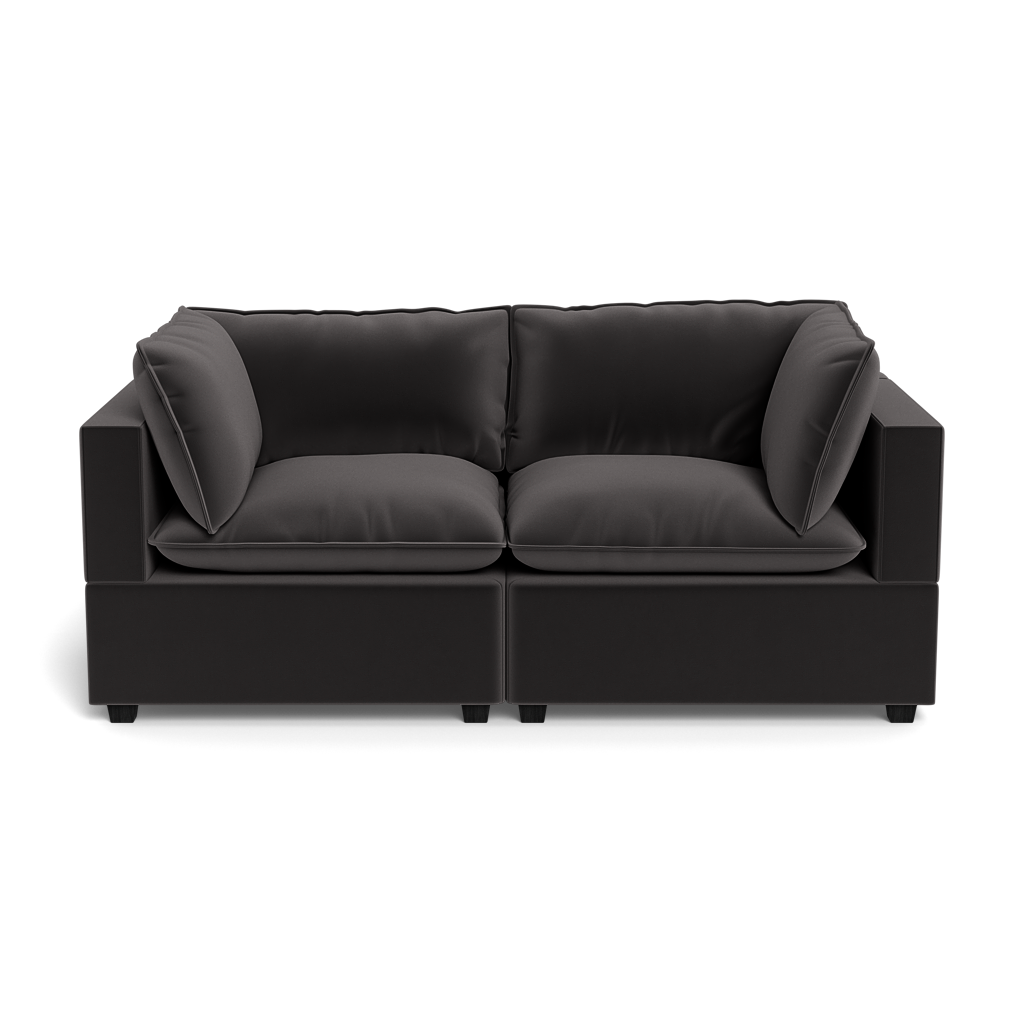 The Kova Pillow Cushion Sofa 86" is a modern black two-seater with thick cushions and large square armrests, shown from the front against a plain black background.