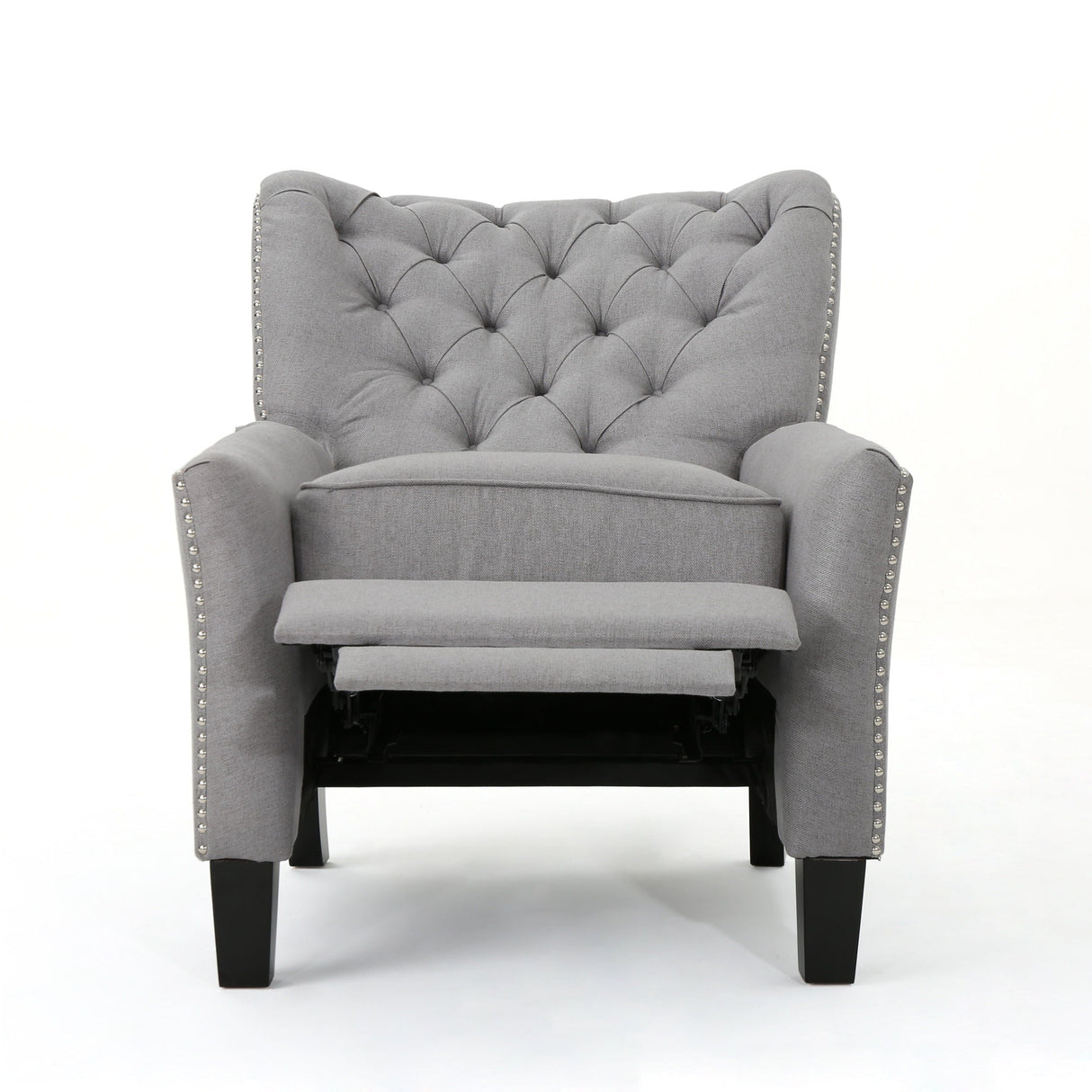 The Modern Push Back Recliner features gray upholstery with diamond tufting on the backrest, silver nailhead trim on the armrests, an extended footrest, and four dark wooden legs, all set against a white background.