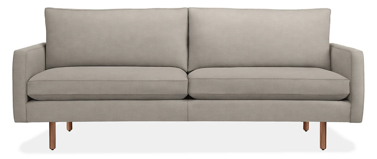 Introducing the 86" Jasper Sofa, a modern piece in light gray, featuring two seat cushions and two back cushions. It boasts slim armrests and stands on four wooden legs, embodying a minimalist and contemporary design.