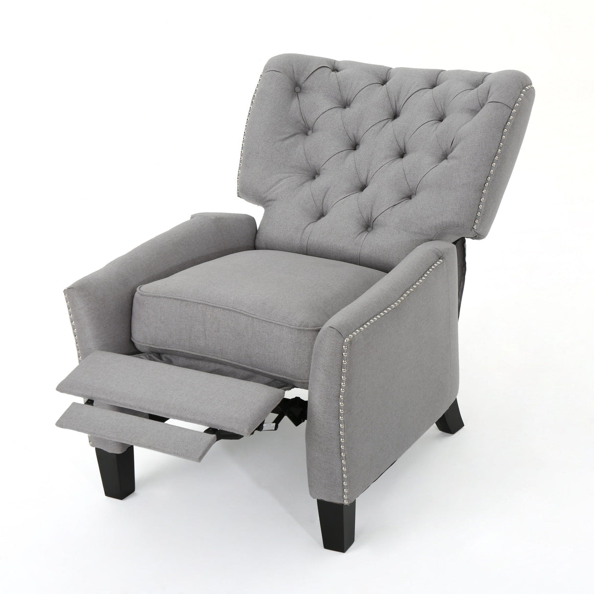 A Modern Push Back Recliner in gray features a tufted backrest, studded detailing, extended footrest, and dark wooden legs.