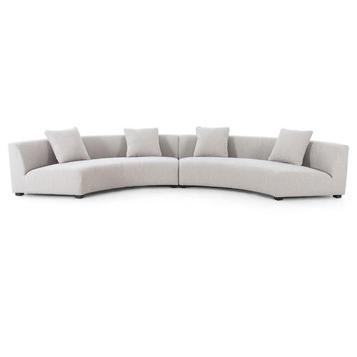 Introducing the Zoe Modern White Performance Black Birch Wood Piece Curved Sectional. This contemporary sofa boasts a stunning curved design in light gray fabric, complete with four coordinating square cushions. Its sleek lines and low profile contribute to a chic minimalist aesthetic, perfect for modern living spaces.