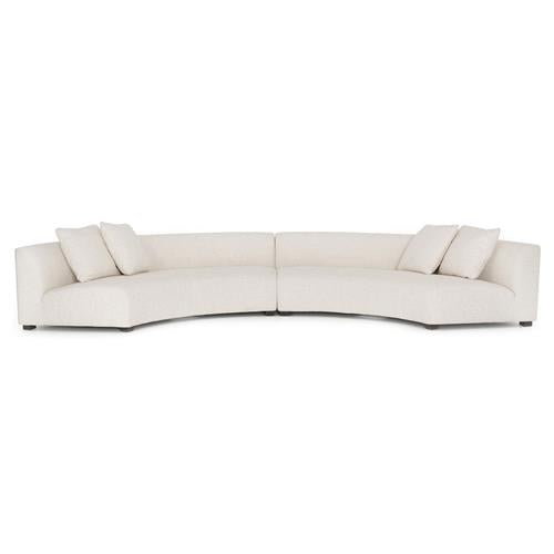 Introducing the Zoe Modern White Performance Black Birch Wood Piece Curved Sectional: a spacious and contemporary sofa featuring three seat cushions and four square pillows. Its low-backed design offers a sleek, minimalist style, making it an ideal addition to modern interiors.