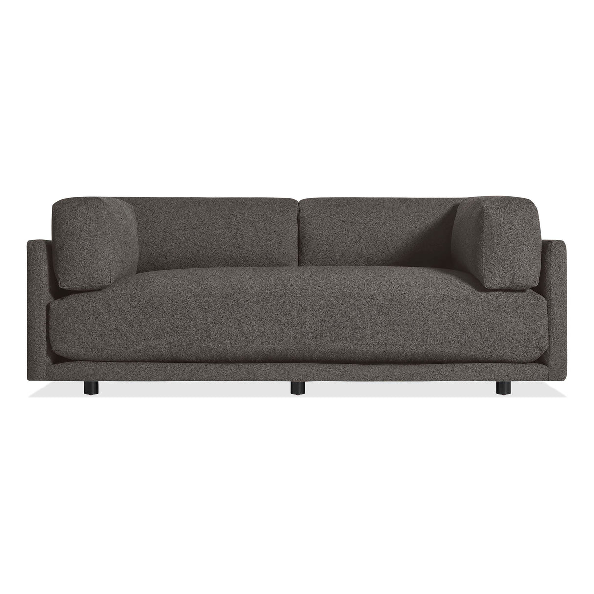 The Sunday 82" Sofa in Kelso Charcoal features a modern design with dark gray upholstery, clean lines, low arms, and short black legs, shown against a white background.