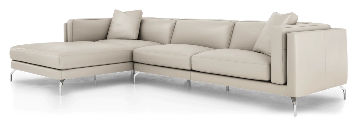 Introducing the Reade Sectional Sofa: a modern beige L-shaped sectional featuring sleek metal legs and plush cushions. Accentuated by two square throw pillows at the corners, it embodies a contemporary design.