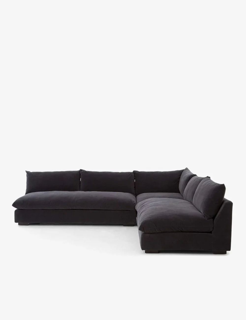 Introducing the Decima Sectional Sofa, an L-shaped masterpiece in dark gray, complete with deep cushions for ultimate comfort. Its modern design stands out beautifully against a plain white background.