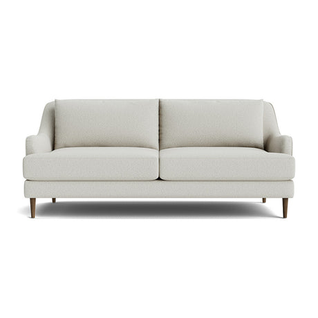 The Kaydan Sofa is a modern light gray piece with a minimalist design, featuring two seat cushions and two back cushions. It includes slightly angled armrests and stands on short, tapered wooden legs, set against a plain white background.