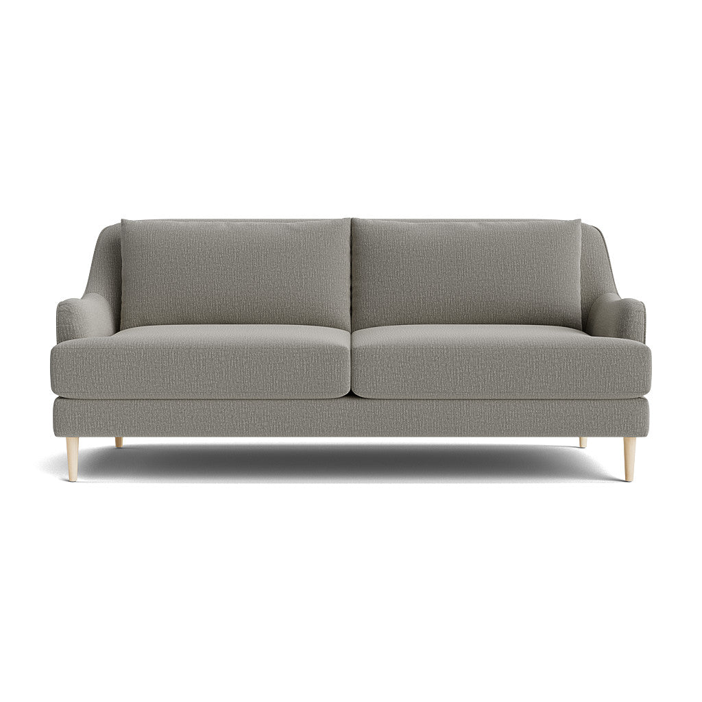 The Kaydan Sofa, displayed on a white background, showcases its modern gray design with light wooden legs. It features two seat cushions and two back cushions, embodying a minimalist style ideal for contemporary interiors.
