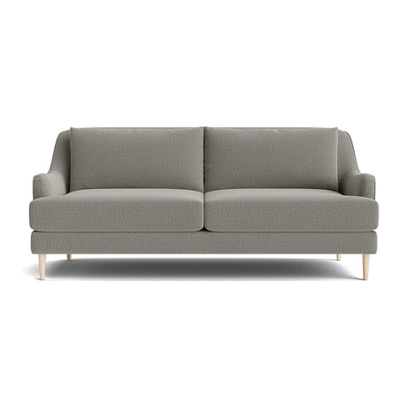 The Kaydan Sofa, displayed on a white background, showcases its modern gray design with light wooden legs. It features two seat cushions and two back cushions, embodying a minimalist style ideal for contemporary interiors.