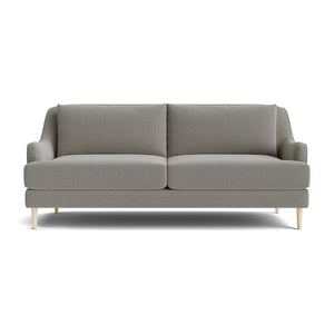 The Kaydan Sofa, displayed on a white background, showcases its modern gray design with light wooden legs. It features two seat cushions and two back cushions, embodying a minimalist style ideal for contemporary interiors.