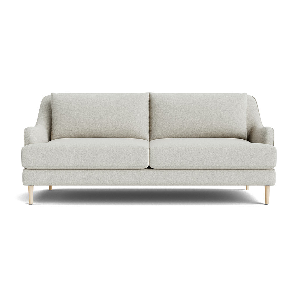 The Kaydan Sofa is a modern piece with a light gray finish, featuring two large cushions and a minimalist design. It boasts a clean, simple appearance with wooden legs, perfectly showcased against a plain white background.