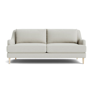 The Kaydan Sofa is a minimalist beige piece featuring two cushions and wooden legs, set against a white background.