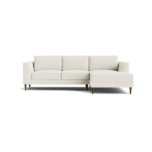 Introducing the Dekayess Chaise 98" Sectional: a minimalist beige sofa with a modern design, featuring three seat cushions and an attached chaise on the right side. It boasts clean lines and rests gracefully on four slender wooden legs against a white background.