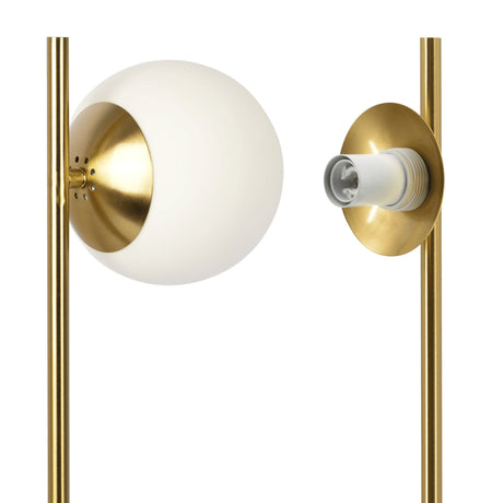 Close-up of the Ethereal Modern Small Table Lamp, featuring a brass finish with a spherical white glass shade on one side and an exposed bulb holder on the other, both mounted on slim vertical rods. This desk lamp offers a sleek, minimalist design.