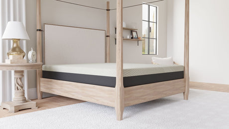 A modern bedroom with a light wood canopy bed, an 8" Comfort Series Firm Gel Memory Foam Tight Top Mattress, a round side table with lamp and clock, floating shelves, a window, and a light rug on wooden flooring.