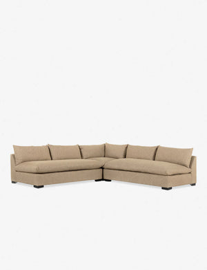 The Decima Sectional Sofa in beige, featuring plush cushions and an L-shaped design, set against a plain white background.
