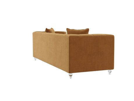 The Bea Velvet Tufted Sofa features a mustard-colored velvet upholstery with a tufted backrest and comes with two matching throw pillows. This sofa boasts a classic design, complete with clear acrylic legs, and is showcased from a backside angle against a white background.