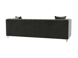 The image displays the back view of the Bea Velvet Tufted Sofa in a dark green color, featuring two cushions. It has a sleek, rectangular design with crisp lines and rests on four glossy, transparent legs.